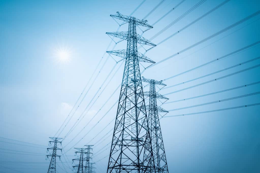 electricity transmission closeup pylon with a blue sky